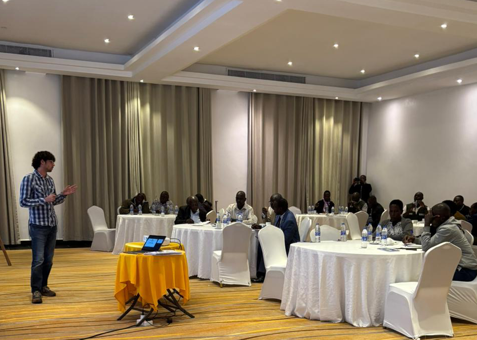 A man (Tomas Messaudi) is training 50 cooperative members on how to recognize and deal with the most common diseases on Oil Palm in the filed.
