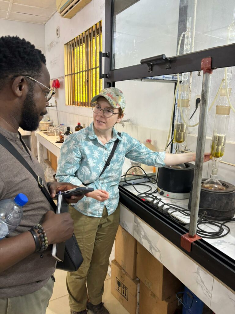 Dr Madec explaining the oil extraction process in a lab in PalmElit's site of production and research center in Benin.
